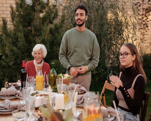 A family enjoying a Mediterranean dinner outdoors